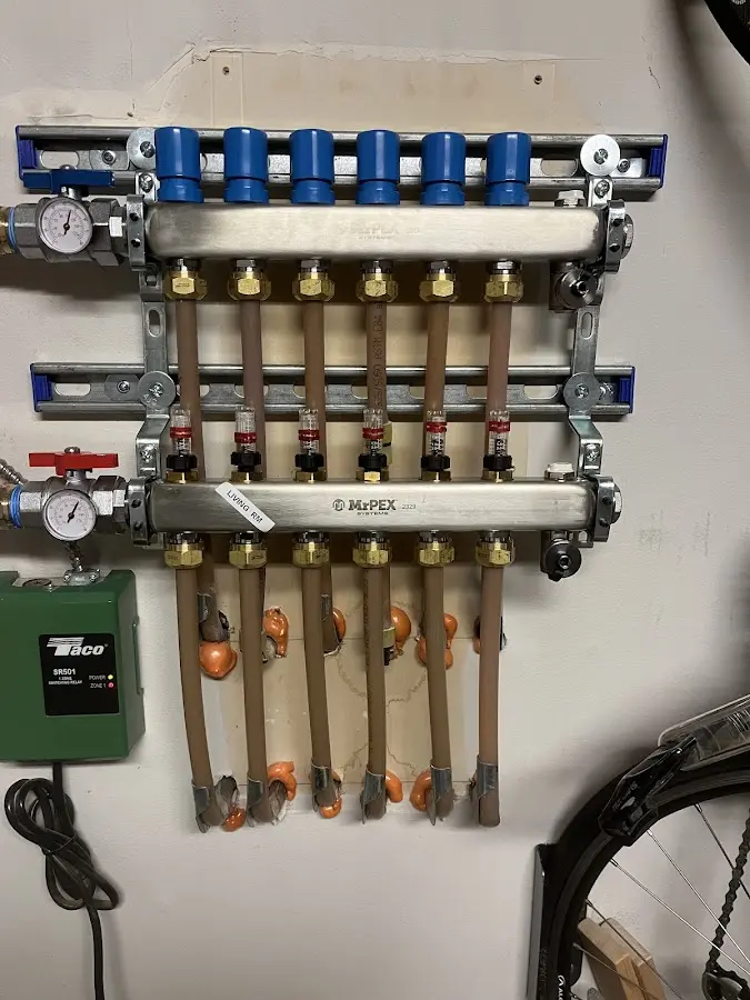 Plumber performing Water Heater Repair at a residential property in Lochearn